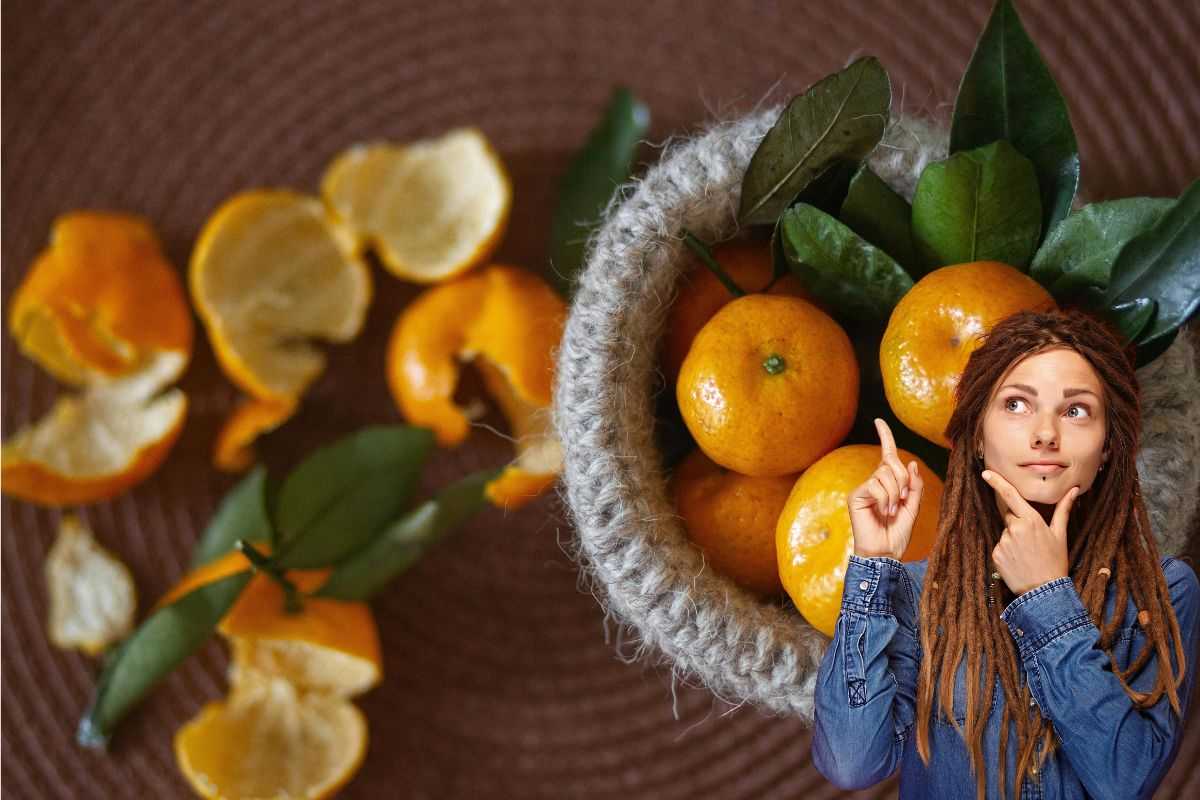 Ragazza che riflette e bucce di mandarino
