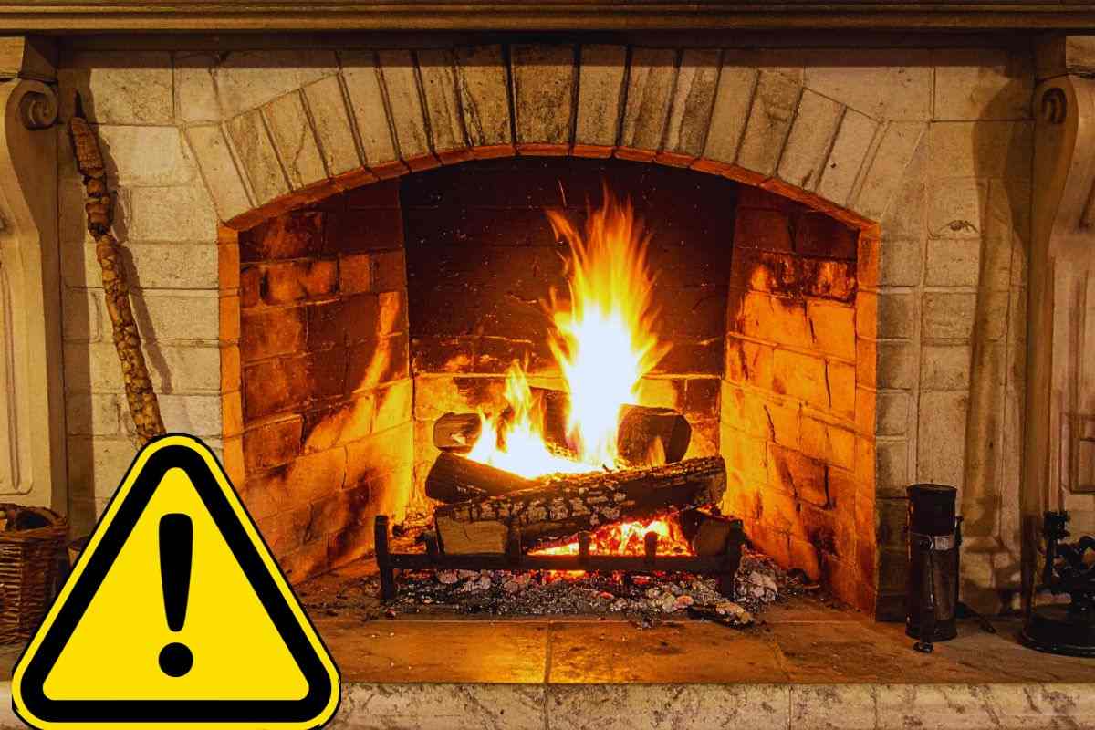 Segnale di pericolo accanto a camino acceso